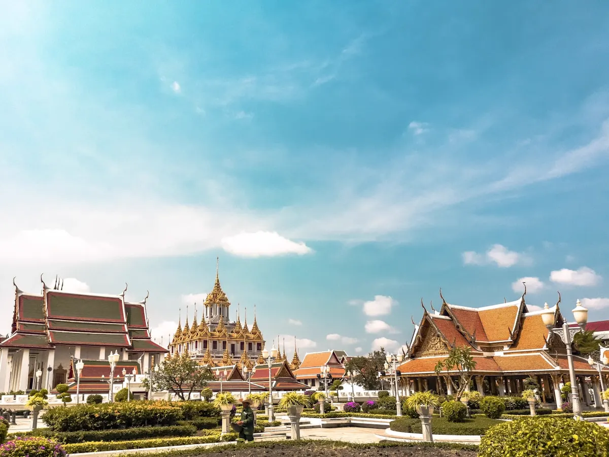 A temple complex in Bangkok under a blue sky
